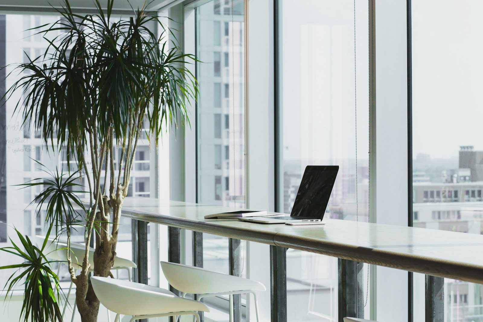 Modern boardroom with team gathered around a large table for a strategic meeting