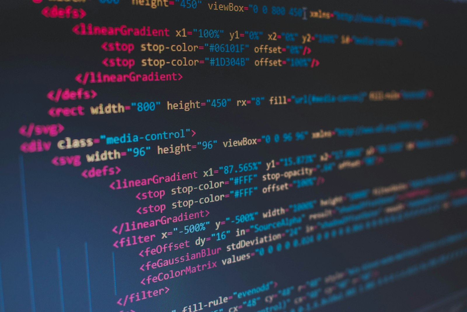 Close-up of SVG and HTML markup on a code editor screen