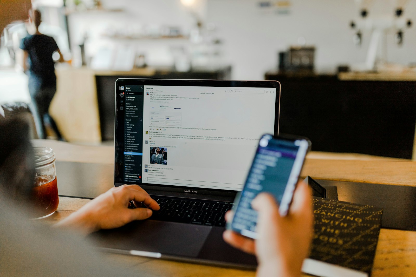 Hands holding a mobile phone — the fintech app in context