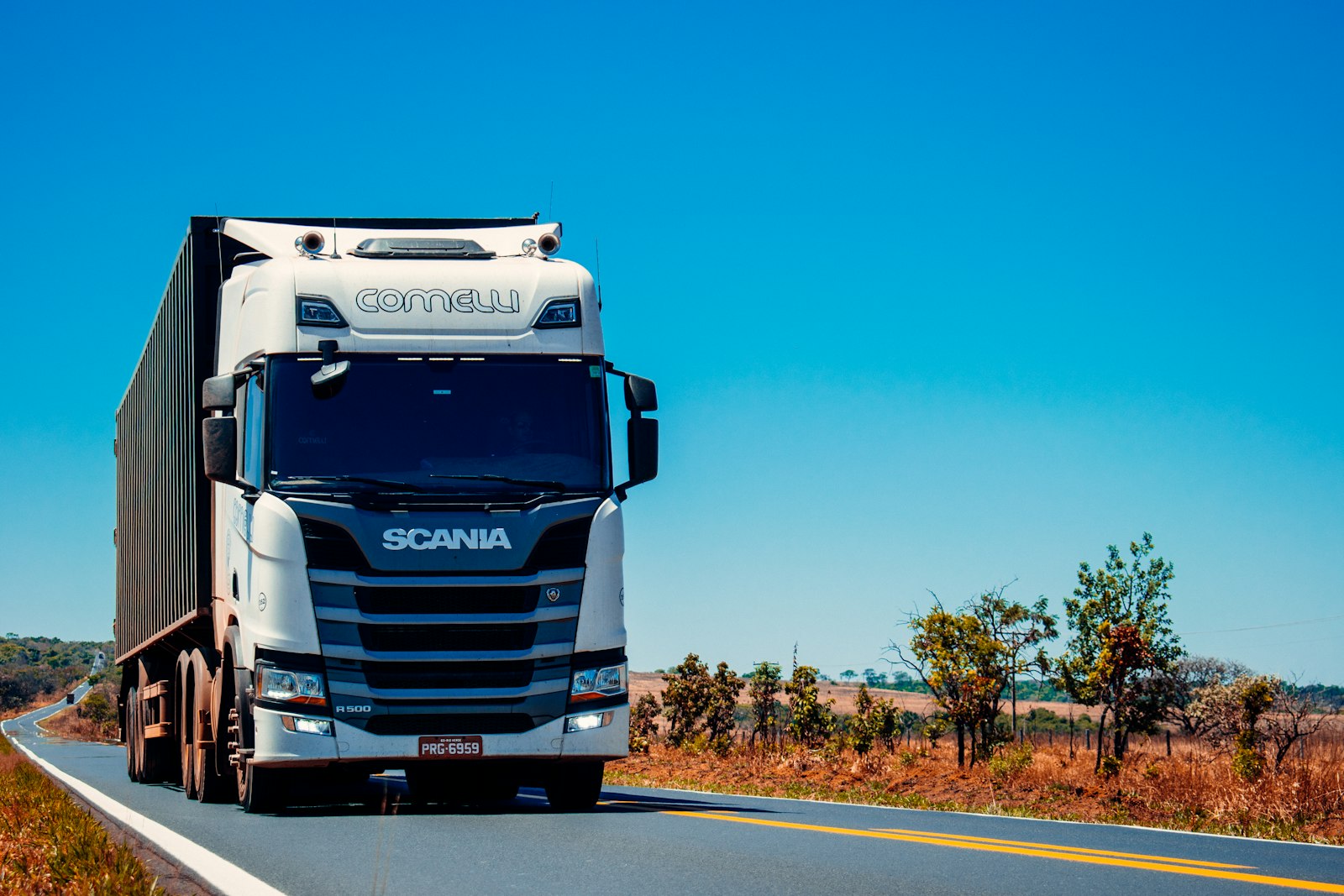 A logistics fleet lined up at a distribution yard